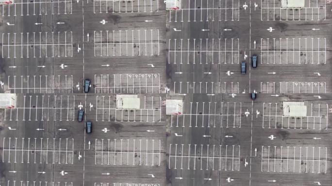 自上而下的无人机射击透视跑车在空停车位上互相追逐