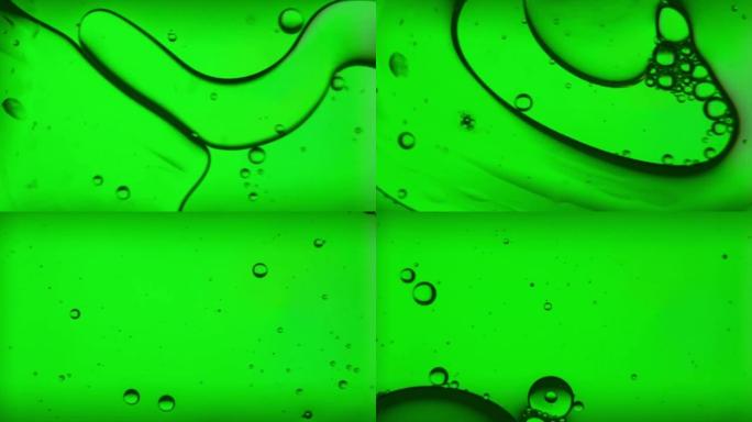油泡，浅绿色灯光下的水上条纹，宏观