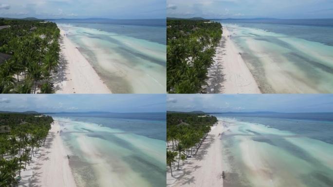 无人机飞越菲律宾薄荷岛的白色沙滩。在天堂保和岛上海边的热带地区放松。保和岛度假胜地海滩的电影无人机镜