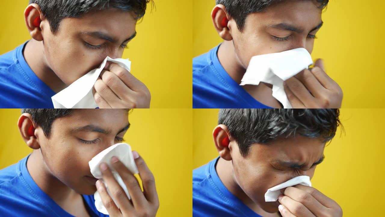 患流感的男孩用餐巾纸鼻涕。