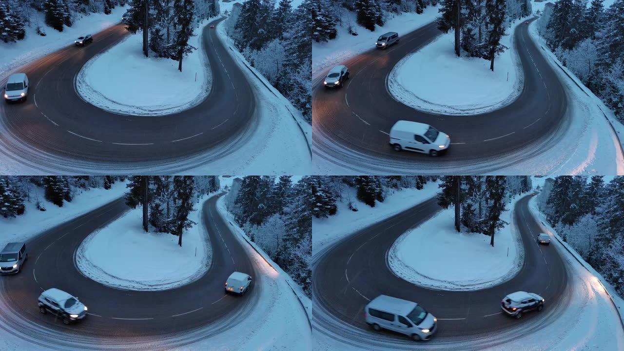 在白雪皑皑的乡村中，车辆在弯道上行驶的空中无人机拍摄