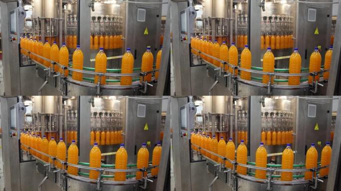 工厂输送带上的瓶装果汁饮料生产线
