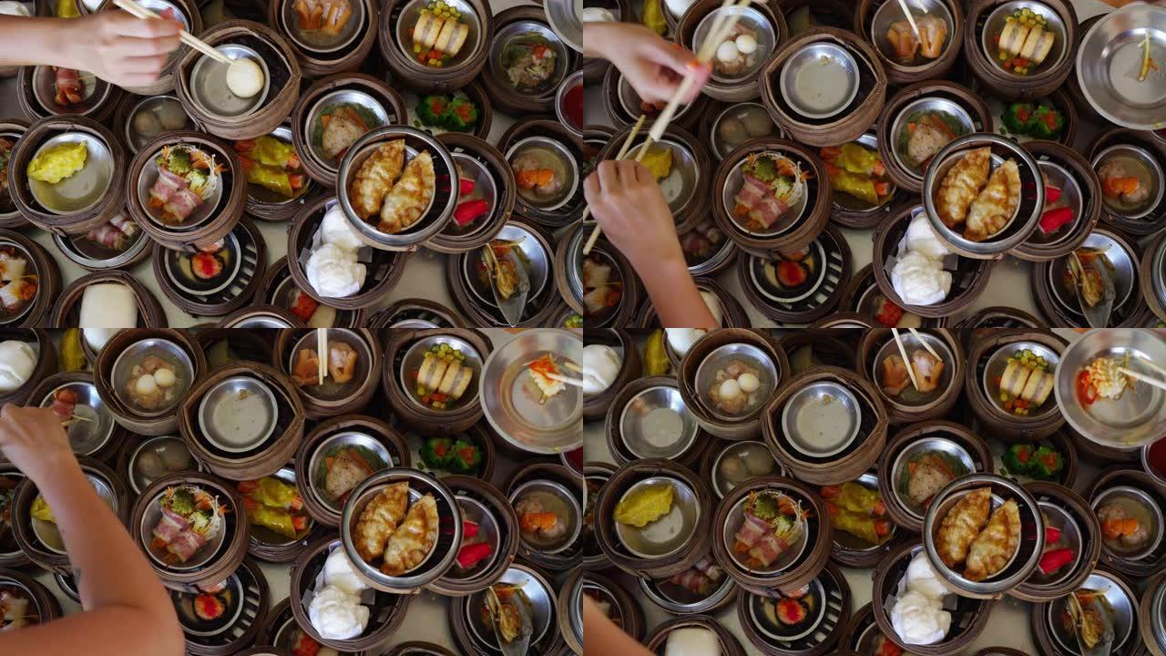 亚洲女人用筷子吃中餐饺子的4k俯视图组