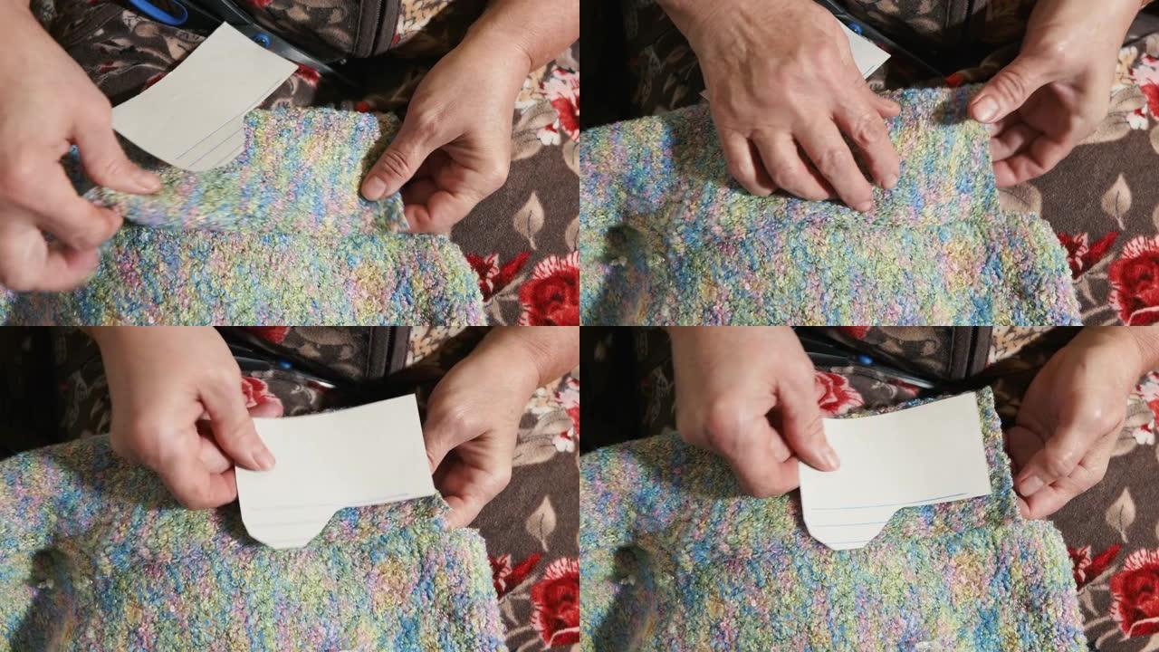 活跃的老年祖母用自己的双手为孙子制作袜子。