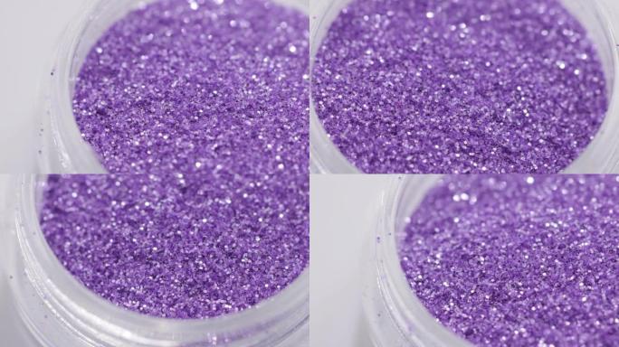 罐子里的紫色亮片绕一圈旋转。高质量4k镜头