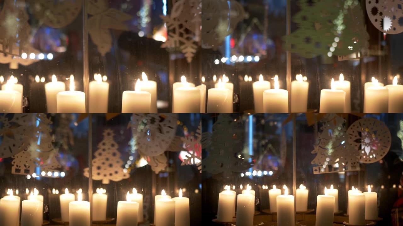 降临节白色蜡烛上的旋转装饰由胶合板制成，描绘天使或圣诞树10p2