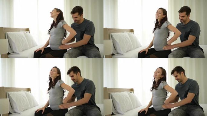丈夫给怀孕的妻子按摩，这样妻子就可以放松身心，心情很好，这会给子宫里的孩子带来好心情。