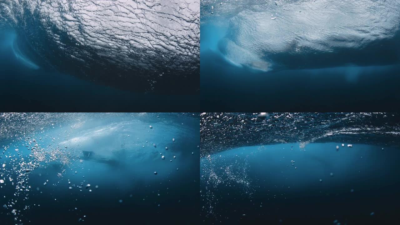 水下海浪。透明水和带bodyboarder的破桶波