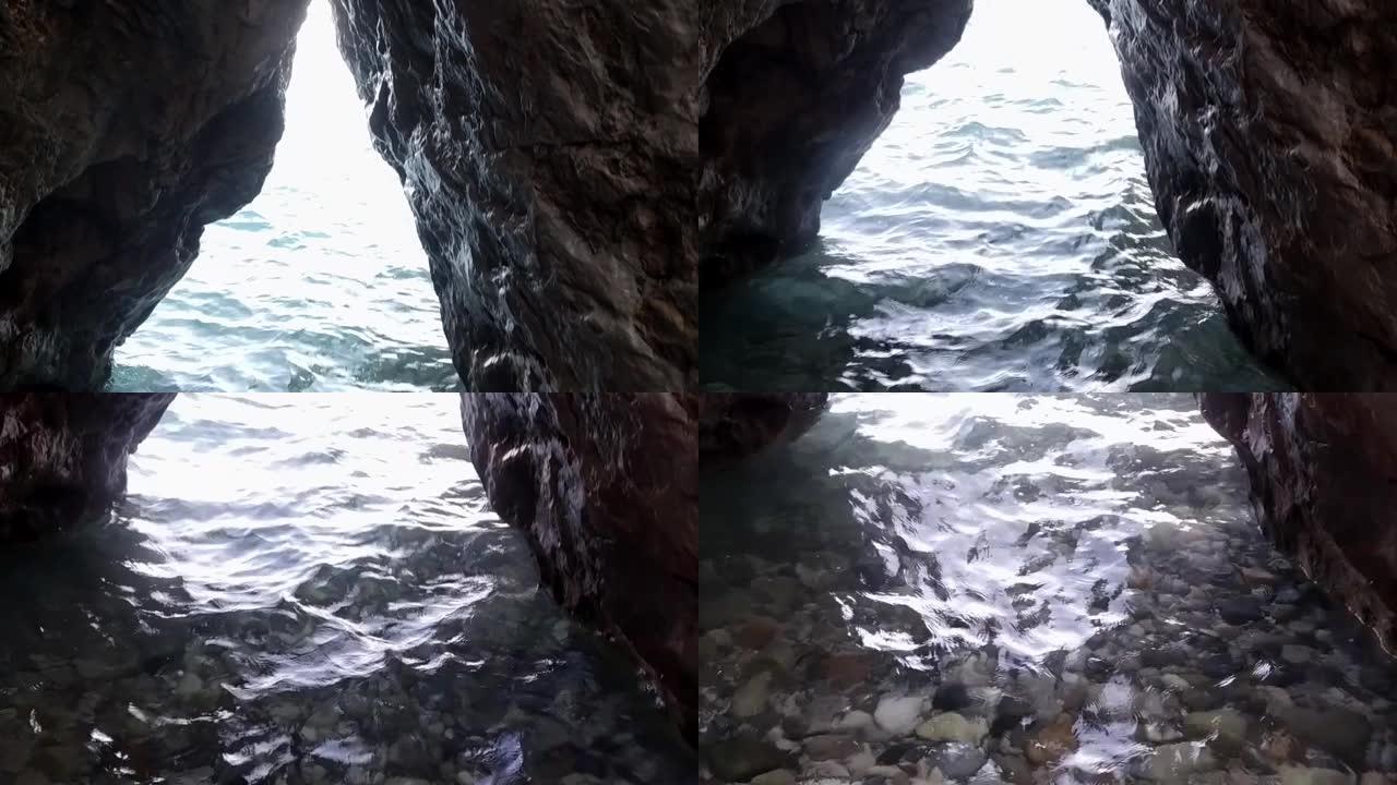 海边的岩石海岸。天然洞穴。