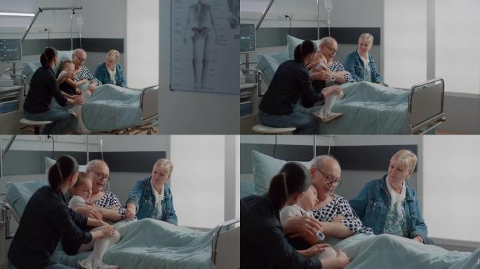 探视时在医院病房里拥抱生病的爷爷的孩子