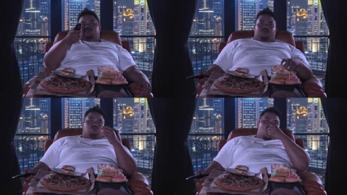 胖子看电视吃垃圾食品