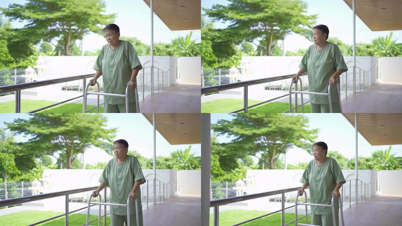 老年残疾亚洲患者或养老金领取者使用助行器练习在医院的疗养院散步。老年人生活方式活动娱乐。保健物理疗法
