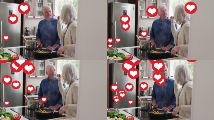 社交媒体心脏图标在厨房里做饭的高级夫妇的动画