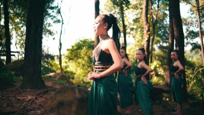 一名穿着绿色连衣裙的亚洲妇女在森林中央与女友闲逛时走近一名男子