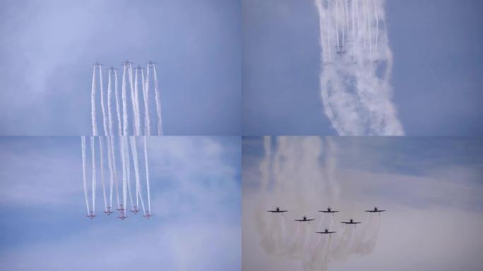 一群军机排放白色气体，在蓝天中以极快的速度飞行