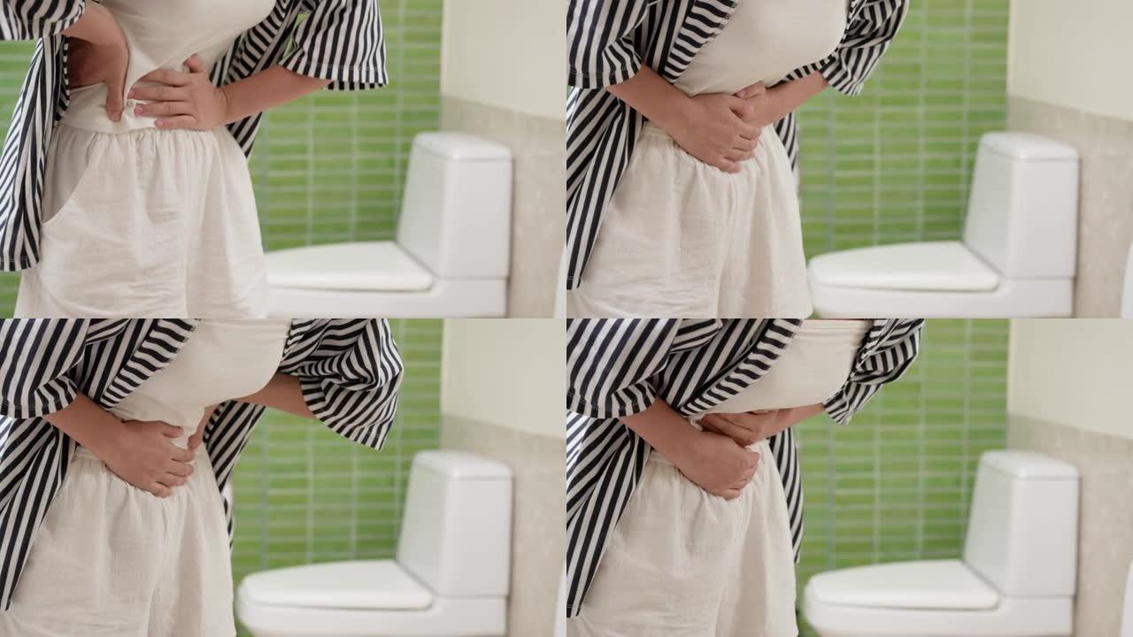 便秘和腹泻在浴室。受伤的女人摸肚子疼。结肠炎症问题，有毒食物，腹痛，腹部，厕所便秘，胃痛，卫生