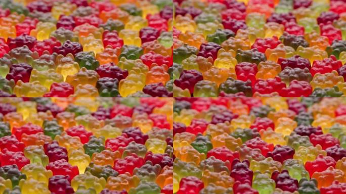 彩色果冻熊糖果的全框循环旋转背景