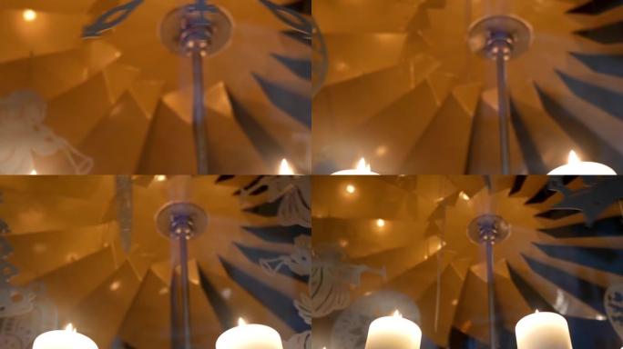 降临节白色蜡烛上的旋转装饰由胶合板制成，描绘天使或圣诞树13p2