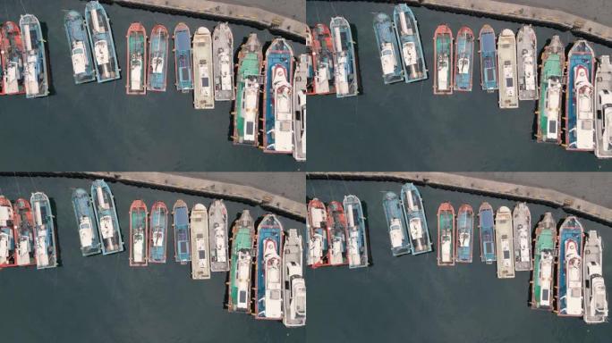 海洋码头与五彩船特写鸟瞰图，复制空间。