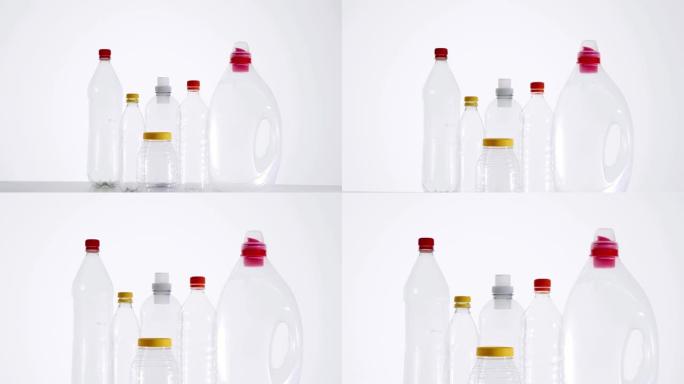 各种没有标签的空透明塑料瓶，随时可以回收。特写演播室镜头，没有人