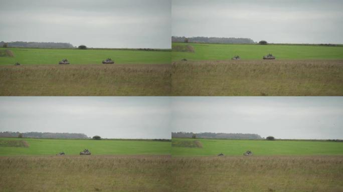 陆军步兵战车在阴暗的日子里穿越乡村的一片草地