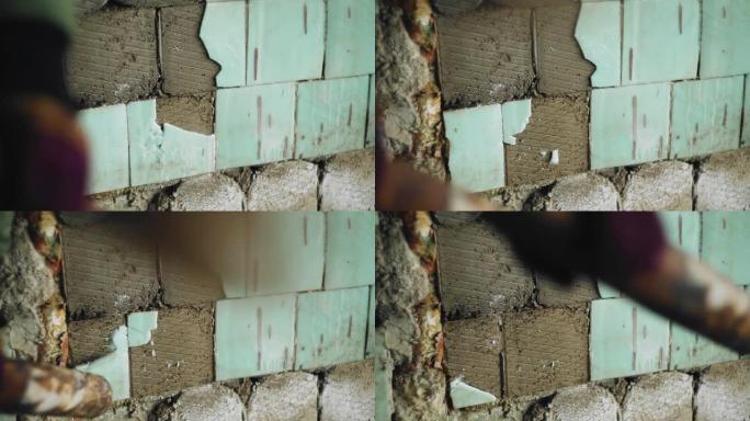 一名男子在一座废弃的老建筑里砸瓦片。他用球棒击打墙壁