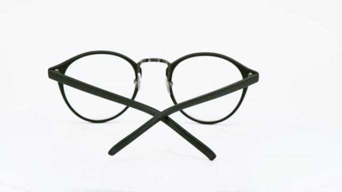 白色背景上的眼镜，黑色眼镜圆形运动圆形度旋转。