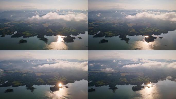 带着雾气飞越局部山脉和湖泊。空中延时视频