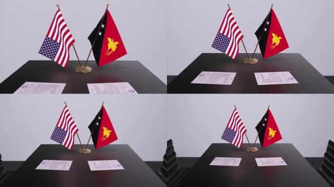 巴布亚新几内亚与美国在谈判桌上达成外交协议。商业和政治动画。国旗，外交协议。桌上的纸质文件。国际协议
