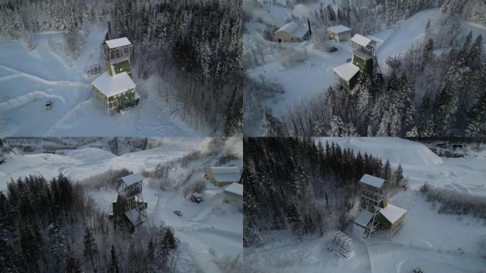 在森林的乡村中，白色积雪覆盖的狩猎小屋的无人机镜头