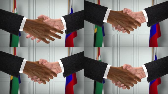 南非与俄罗斯协议握手，政治例证。正式会议或合作，商务见面。商人和政客握手