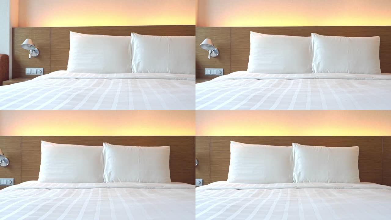 标准酒店客房卧室，配有白色床单和枕头的睡床，平底锅
