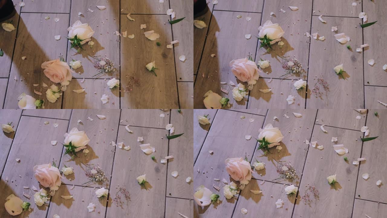 花瓣散落在地板上。拍摄撕裂的花瓣