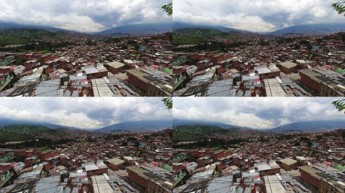 哥伦比亚麦德林市的延时公社13简陋的房屋，山景，山丘和拉丁美洲的天空