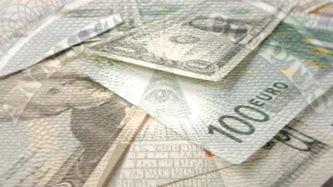 各种面额的旋转美元和欧元纸币特写，上面是金字塔和发光的梅森眼睛。1美元钞票上的金字塔。4k宏原始视频