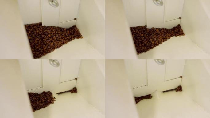 冷却后，将烘焙的咖啡豆送入旋风分离器以清除小碎屑