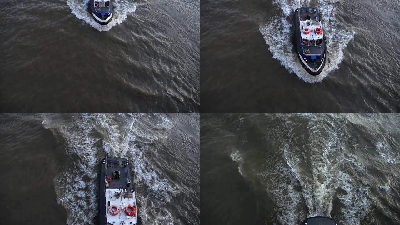 快艇沿着泰晤士河航行。搅动的水面。河水在河里涡流。泰晤士河上从路过的摩托艇上掀起波浪。版本8