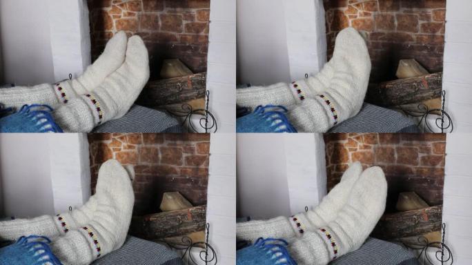 温暖的针织袜子穿在脚上。