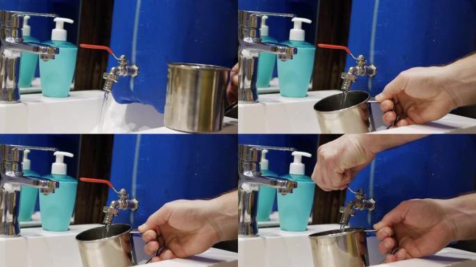 储备水龙头有流动的饮用水，一个人在战时使用储备饮用水，缺水，供水停止在房子里。带水龙头的水罐。