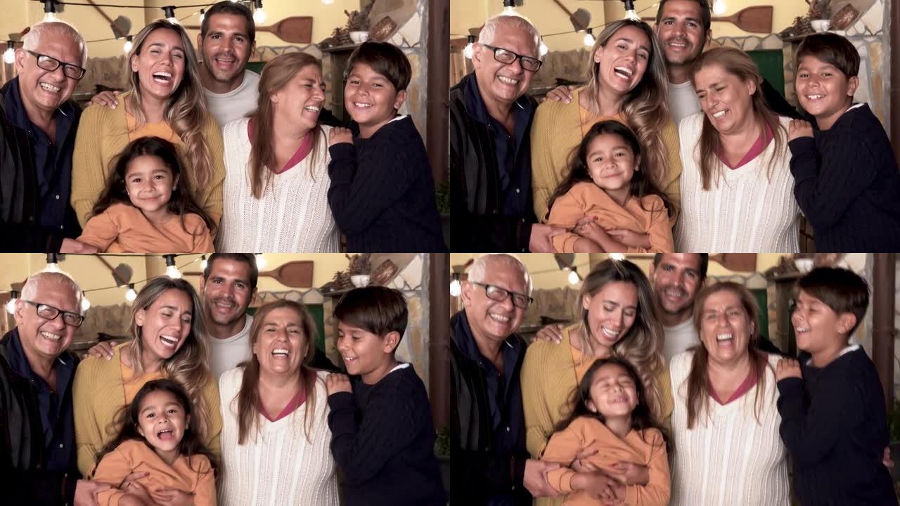 相机上微笑的快乐拉丁家庭-家庭爱情的概念