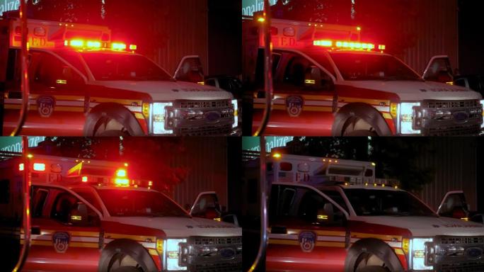 救护车灯闪烁着附近的警车警笛声。广阔的视野
