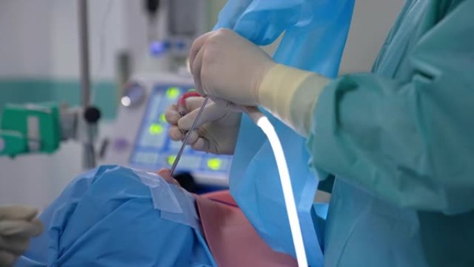 鼻子手术。医生用特殊的无菌医疗器械操作病人。手术工具的手术过程。特写。