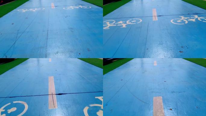 沿着蓝色自行车道骑行。循环路径表面的特写。版本2