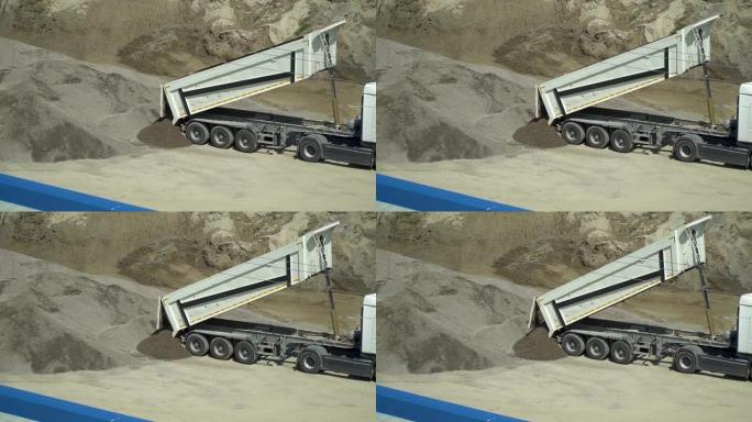 卡车在水泥厂卸砂