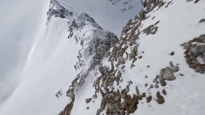 山石登顶速度潜水岩石纹理冬季山谷冰冻电影景观鸟瞰图