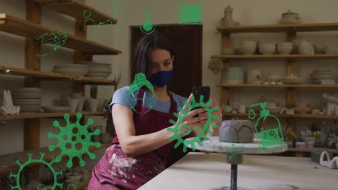 covid 19细胞的动画和戴着口罩在陶器工作室工作的女人的图标