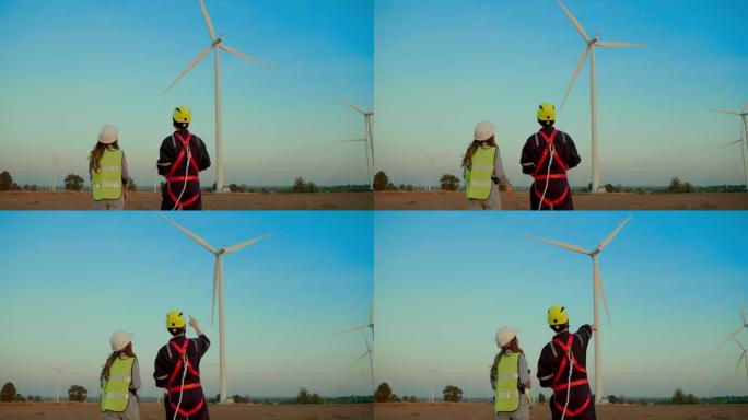 风力涡轮机维护技术人员佩戴安全装备在高处工作。风力发电机异常调查