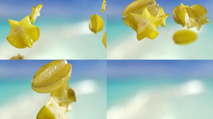 海滩热带夏季背景下的杨桃和星星果片