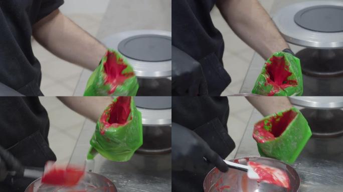 厨师为管道袋4k镜头准备红色熔化填充物