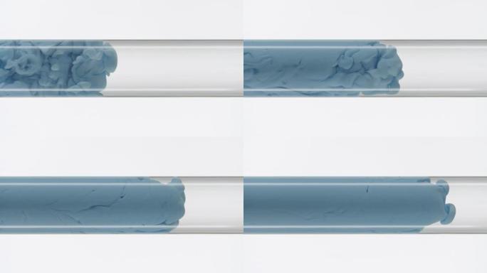 蓝色墨水在白色背景上注满水的玻璃试管